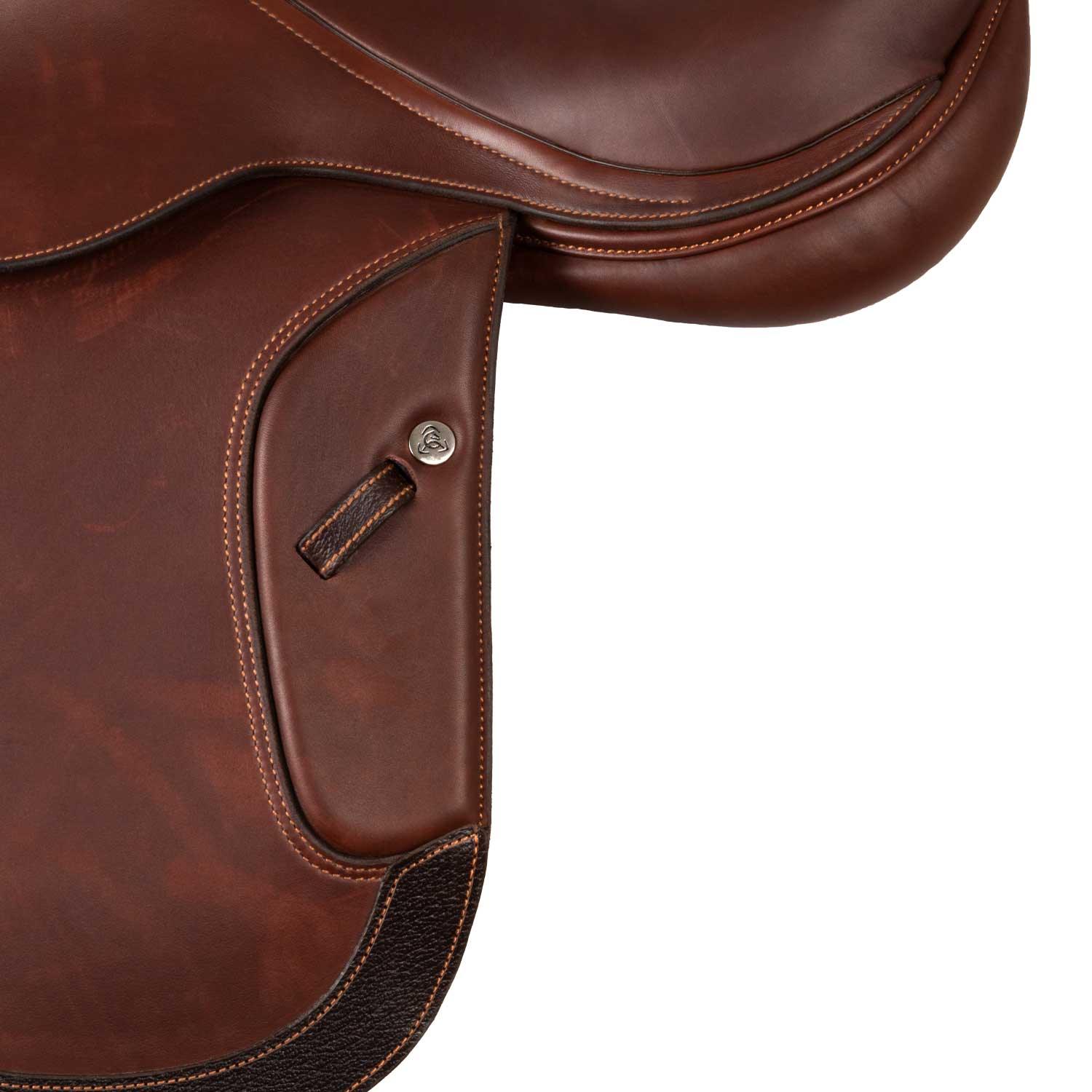 Close-up of a brown leather saddle on a white background