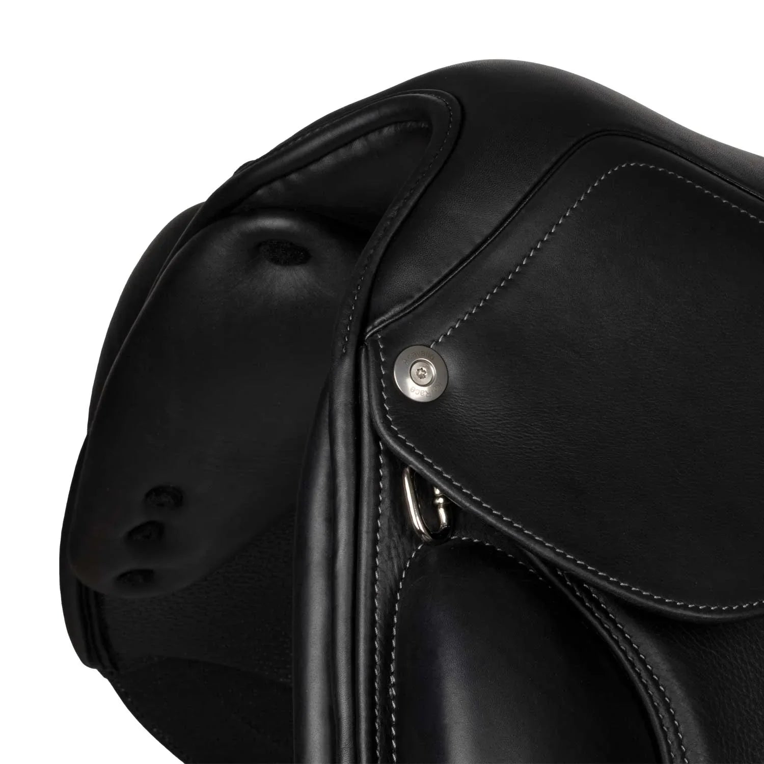 Close-up of a black leather saddle with a button on a white background