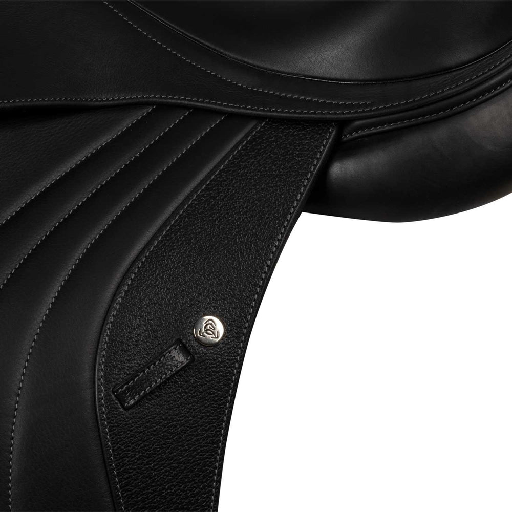 Close-up of a black leather saddle with a brand logo on a white background